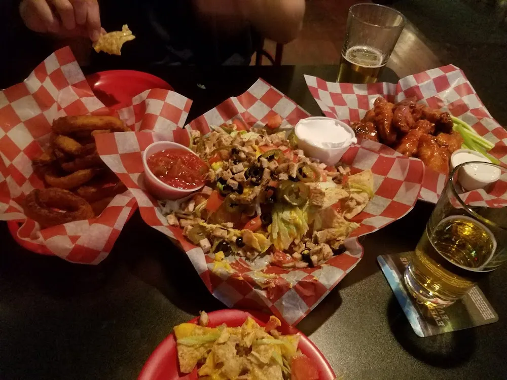 Nachos Supreme Chicken Wings and Onion Rings